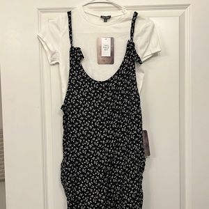 Small black and white jumper with white crop top underneath. Two piece set